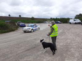 Rotarian Alex Bowes waves to one of the drivers arriving at the stage at Fetteresso Forest. 